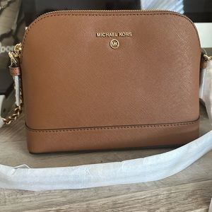 Michael Kors Crossbody bag. BRAND NEW! Protective paper still around it.